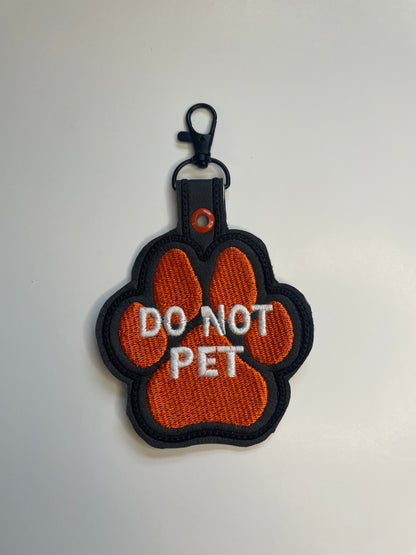 Orange Paw-Shaped Snap Tab – 4.25” x 3.5” Safety Tag for Vests, Collars & Leashes