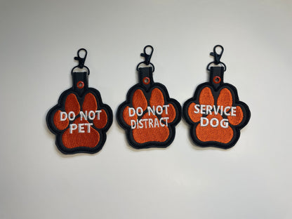 Orange Paw-Shaped Snap Tab – 4.25” x 3.5” Safety Tag for Vests, Collars & Leashes